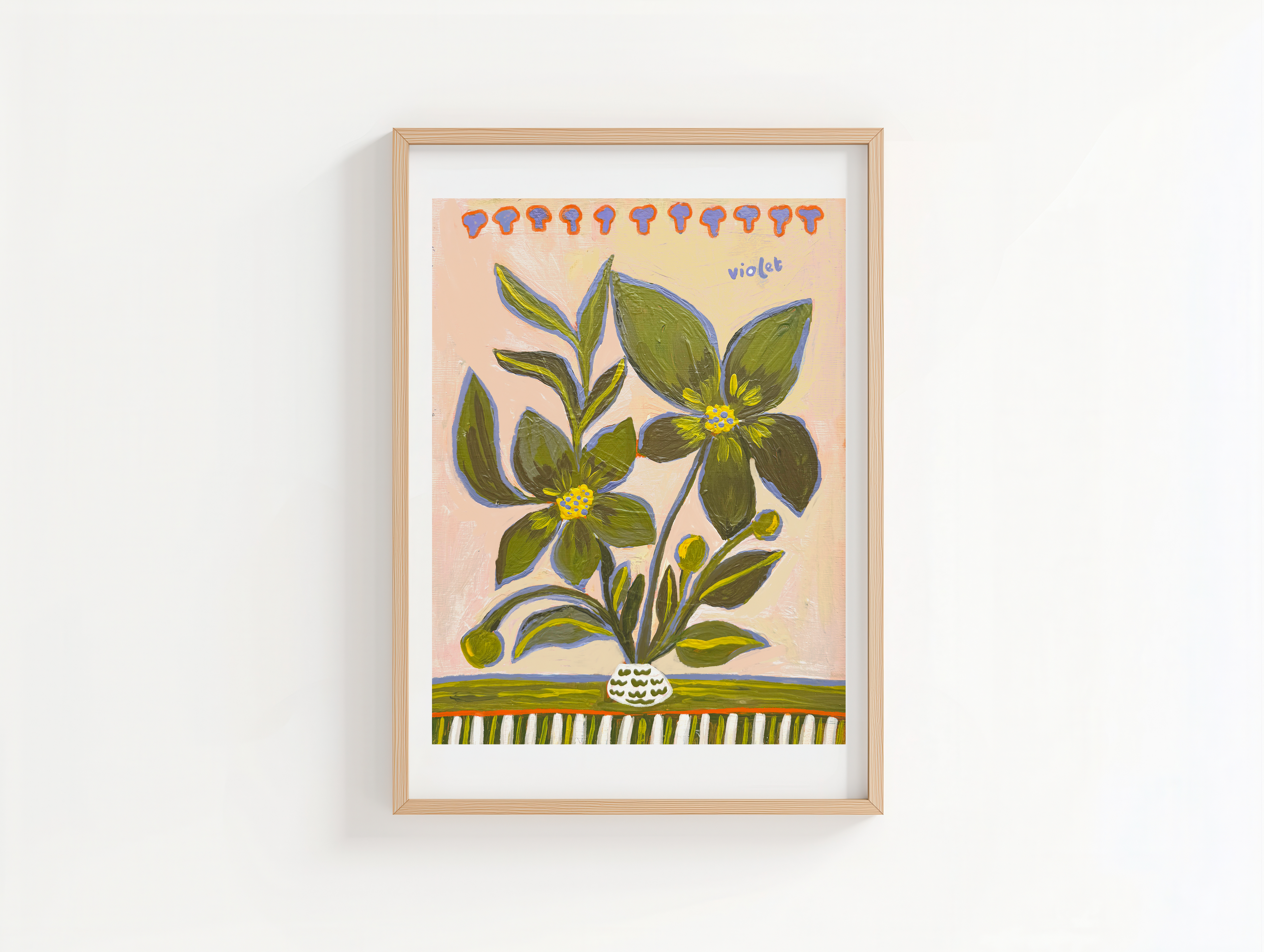 Framed artwork of a floral design on a white wall